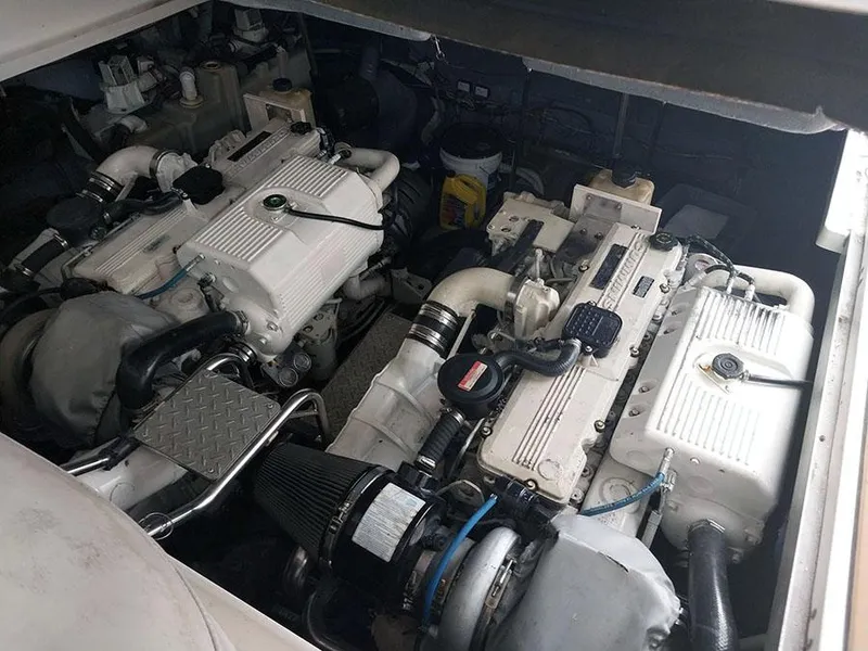 Slide: The Image of Storage compartment on a 2006 Sea Ray 44 Sundancer with cleaning supplies. - 12
