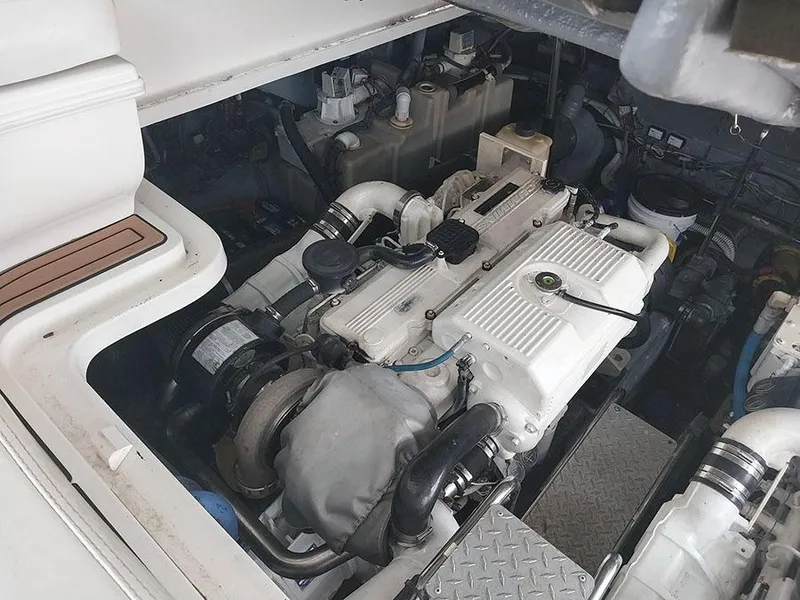 Slide: The Image of Interior of 2006 Sea Ray 44 Sundancer yacht with white seating and control panel. - 13