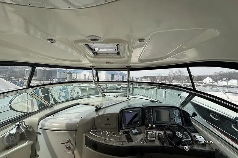 Slide: The Image of Interior view of 2006 Sea Ray 44 Sundancer yacht cockpit with navigation controls. - 15