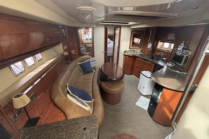Slide: The Image of Luxurious interior of a 2006 Sea Ray 44 Sundancer yacht with elegant wood finishes. - 17