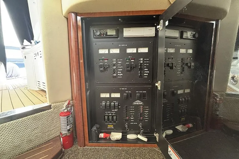 Slide: The Image of Electrical panel inside a 2006 Sea Ray 44 Sundancer yacht, featuring various switches and controls. - 20