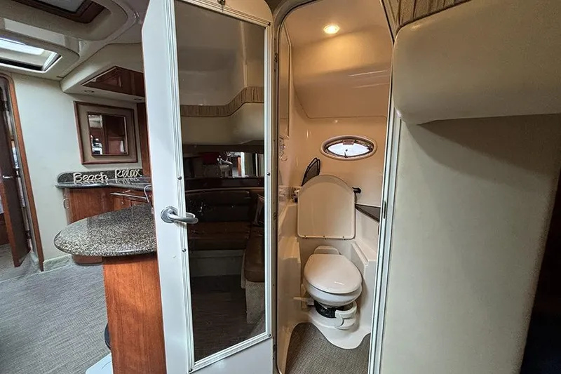 Slide: The Image of Interior of 2006 Sea Ray 44 Sundancer yacht showing bathroom and living area. - 37
