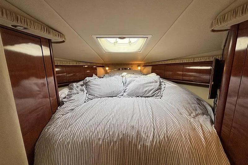 Slide: The Image of Luxurious cabin interior of 2006 Sea Ray 44 Sundancer yacht with cozy bedding. - 39