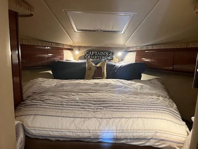 Slide: The Image of Luxurious interior of a 2006 Sea Ray 44 Sundancer yacht with elegant seating and wooden table. - 4