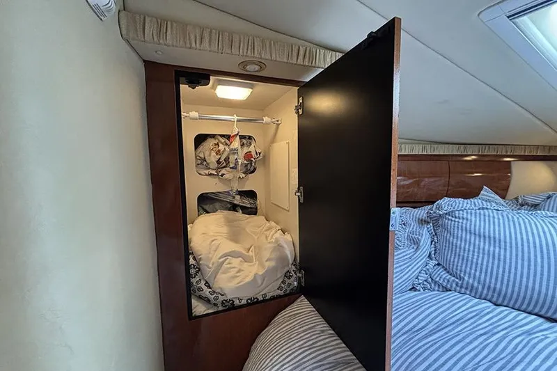Slide: The Image of Interior storage space on a 2006 Sea Ray 44 Sundancer yacht with bedding and light. - 41