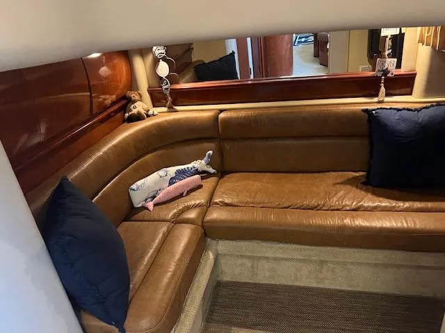 Slide: The Image of Interior of 2006 Sea Ray 44 Sundancer yacht with elegant seating and wooden table. - 5