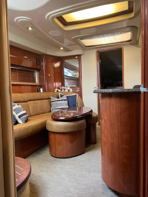 Slide: The Image of Luxurious interior of 2006 Sea Ray 44 Sundancer yacht with elegant seating and wooden table. - 6
