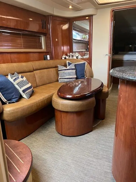 Slide: The Image of 2006 Sea Ray 44 Sundancer yacht interior with sleek cabinetry and seating. - 8