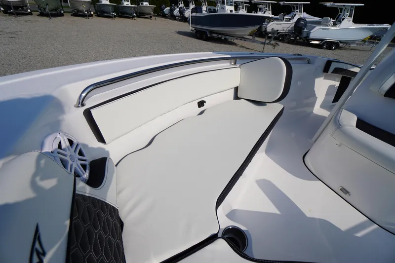Slide: The Image of Interior view of 2026 Tidewater 210 CC Adventure boat, featuring sleek seating and modern design. - 13