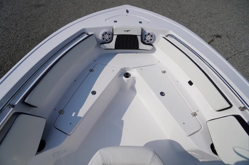 Slide: The Image of 2026 Tidewater 210 CC Adventure boat interior with seating and storage compartments. - 14