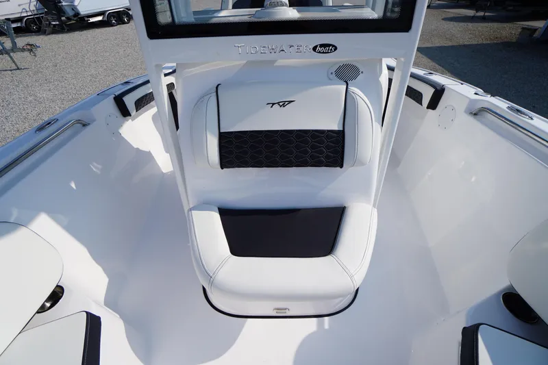Slide: The Image of 2026 Tidewater 210 CC Adventure boat interior with cushioned seating and sleek design. - 17