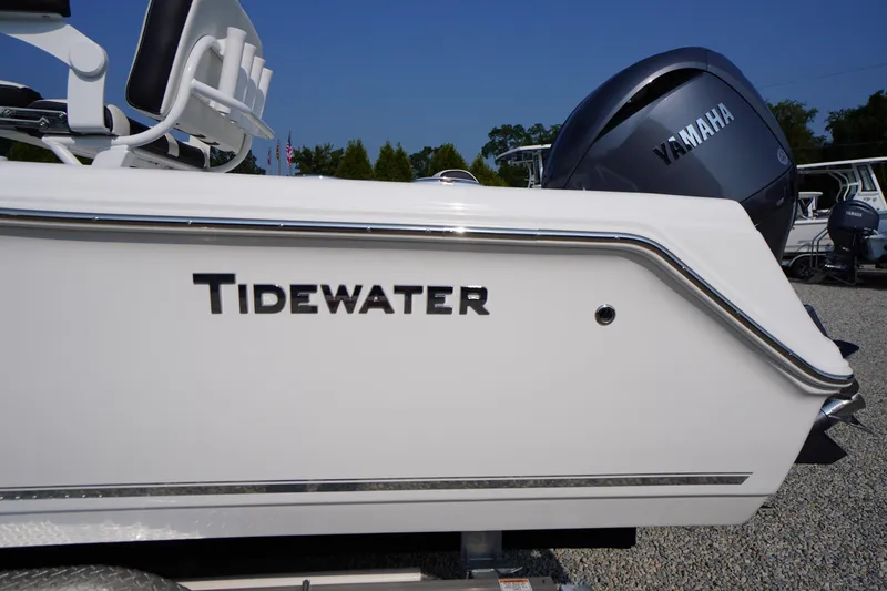 Slide: The Image of 2026 Tidewater 210 CC Adventure boat with Yamaha engine, side view. - 3