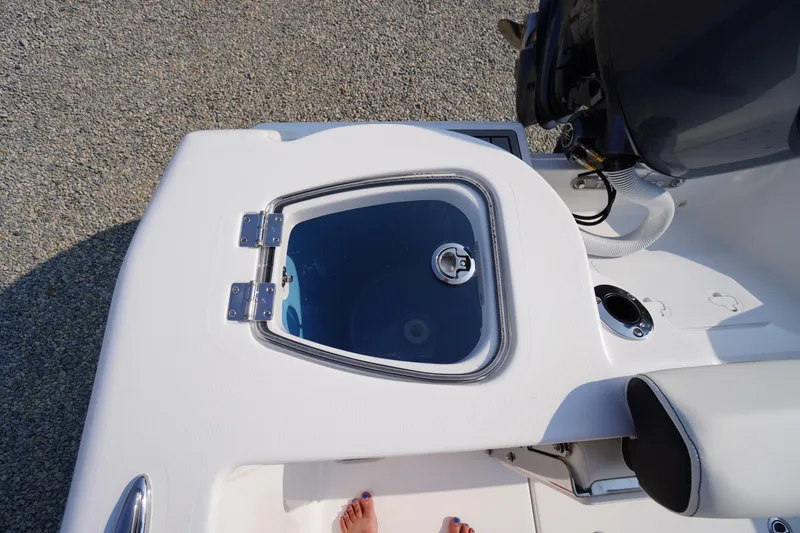 Slide: The Image of 2026 Tidewater 210 CC Adventure boat with livewell and engine detail. - 40