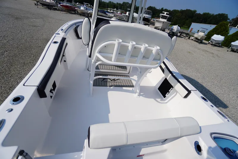 Slide: The Image of 2026 Tidewater 210 CC Adventure boat interior with seating and rod holders. - 41
