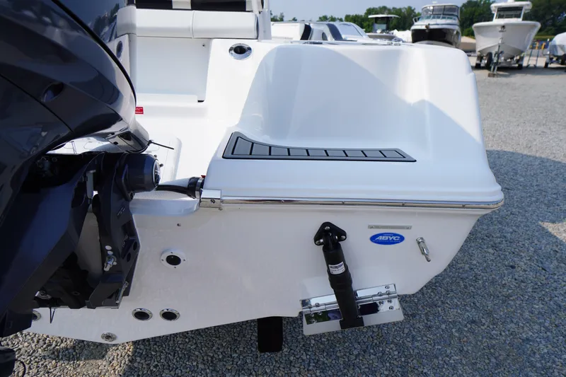 Slide: The Image of 2026 Tidewater 210 CC Adventure boat stern with motor, displayed on gravel lot. - 48