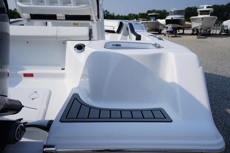 Slide: The Image of 2026 Tidewater 210 CC Adventure boat deck, featuring sleek design and modern amenities. - 49