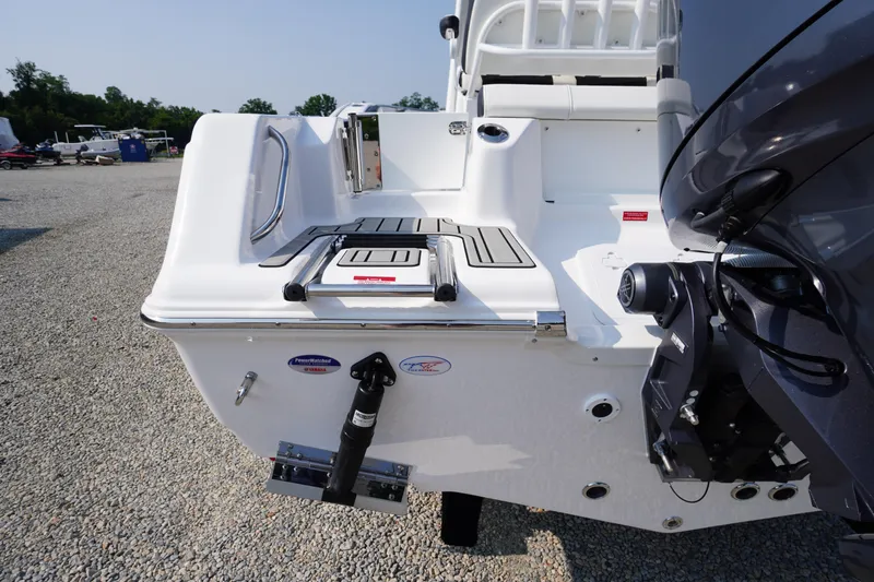 Slide: The Image of 2026 Tidewater 210 CC Adventure boat stern with motor and swim platform. - 51