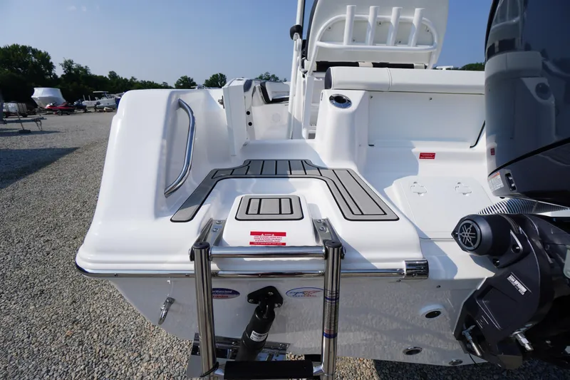 Slide: The Image of 2026 Tidewater 210 CC Adventure boat stern with swim platform and ladder. - 53