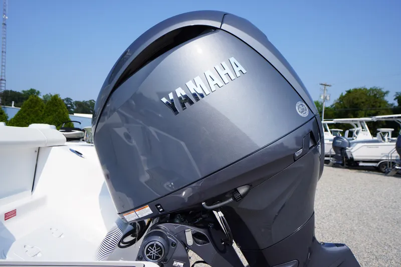 Slide: The Image of Yamaha outboard motor on 2026 Tidewater 210 CC Adventure boat, outdoor display. - 55