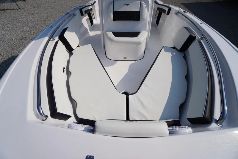 Slide: The Image of 2026 Tidewater 210 CC Adventure boat interior with white cushioned seating and sleek design. - 8