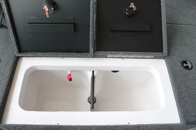 Slide: The Image of 2024 Vexus AVX1980C boat storage compartment with open lids and interior view. - 11