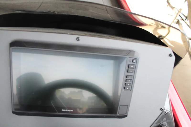 Slide: The Image of 2024 Vexus AVX1980C boat dashboard with Garmin display. - 16