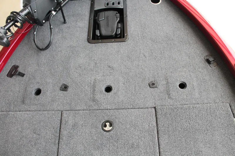 Slide: The Image of 2024 Vexus AVX1980C boat deck with gray carpet and pedal controls. - 19
