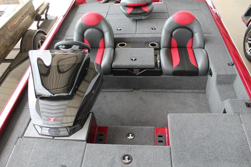 Slide: The Image of 2024 Vexus AVX1980C boat interior with red and black seats, steering console, and storage compartments. - 21