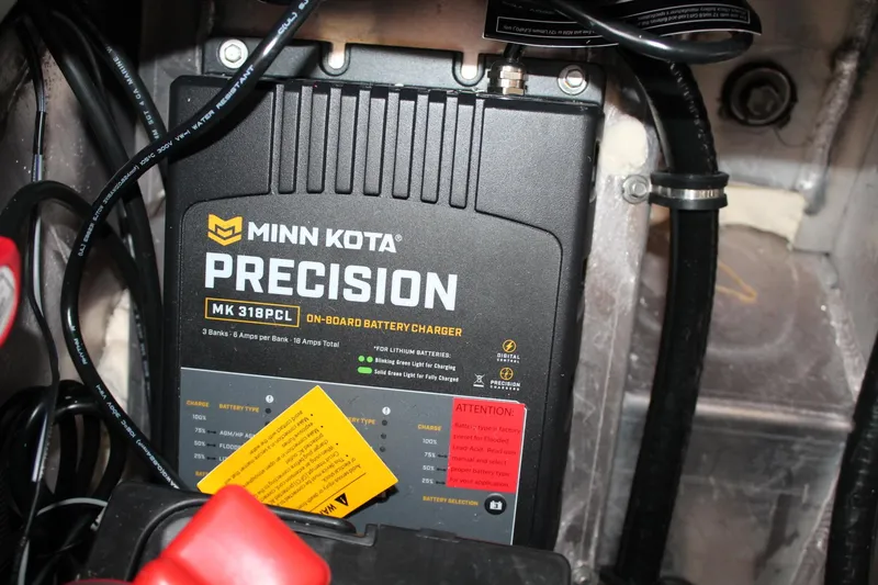 Slide: The Image of Minn Kota Precision MK 318PCL on-board battery charger in a 2024 Vexus AVX1980C boat. - 24