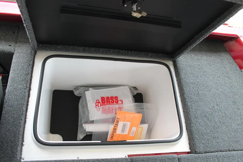 Slide: The Image of 2024 Vexus AVX1980C storage compartment with Bass Mafia gear and important documents. - 9
