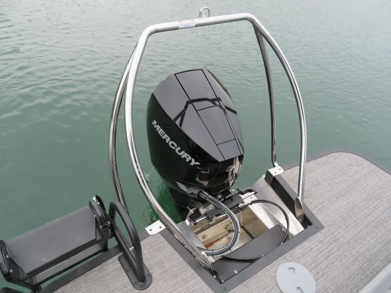 Slide: The Image of 2024 Bennington 23RSB with Mercury outboard motor on calm water. - 12