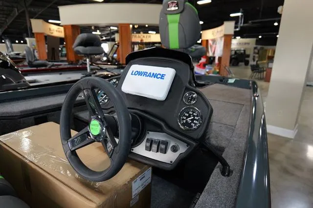 Slide: The Image of 2024 Ranger RT178 boat dashboard with Lowrance electronics and steering wheel. - 4