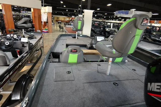 Slide: The Image of 2024 Ranger RT178 fishing boat interior with green seats in showroom. - 6