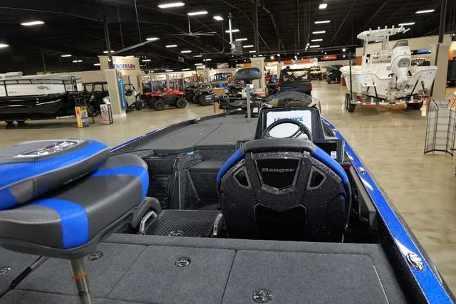 Slide: The Image of 2024 Ranger RZ521RC fishing boat interior at a showroom. - 3