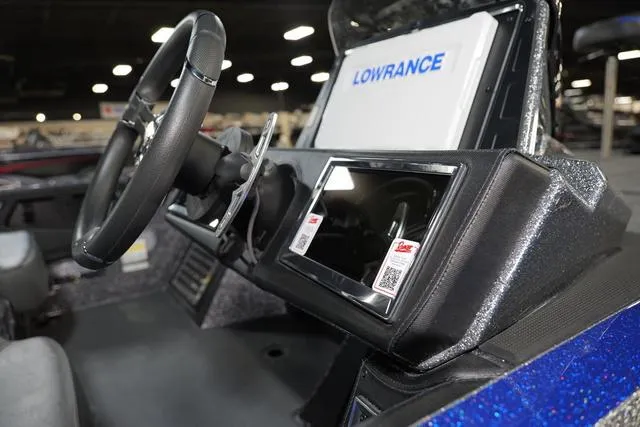Slide: The Image of 2024 Ranger RZ521RC boat dashboard with Lowrance electronics and steering wheel. - 5
