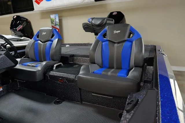 Slide: The Image of 2024 Ranger RZ521RC boat interior with blue and black seats. - 6