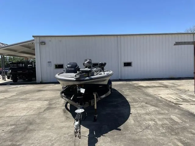 Slide: The Image of 2010 Nitro Z9 boat parked outside a white building on a sunny day. - 7