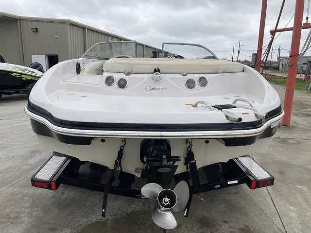 Slide: The Image of 2012 Tahoe Q8SSI boat interior with white seating and dashboard. - 6