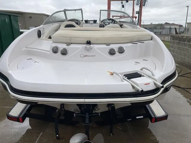 Slide: The Image of 2012 Tahoe Q8SSI boat interior with white and black seating. - 7