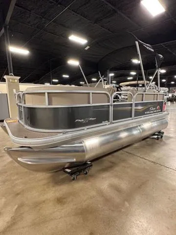 Slide: The Image of 2024 Sun Tracker PARTY BARGE® 16 DLX pontoon boat displayed indoors. - 10