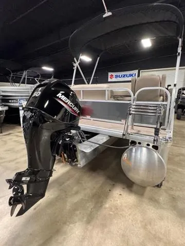 Slide: The Image of 2024 Sun Tracker PARTY BARGE® 16 DLX pontoon boat with Mercury engine in showroom. - 8
