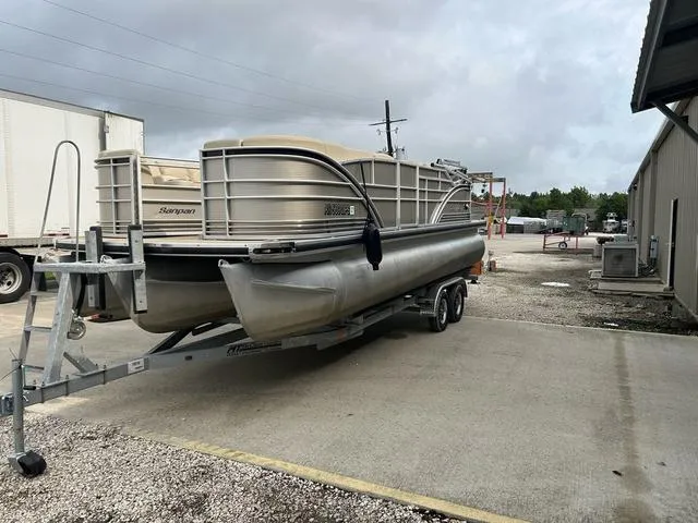 Slide: The Image of 2015 Godfrey SANPAN 2200 SLR pontoon boat on a trailer in an industrial area. - 3