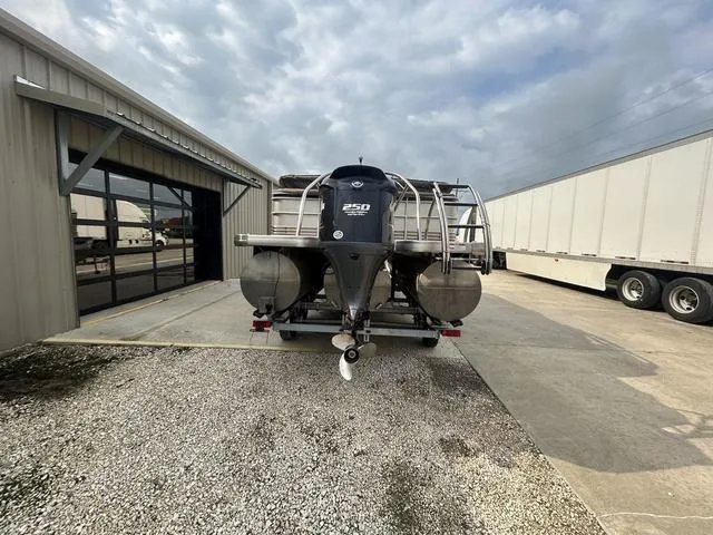 Slide: The Image of 2015 Godfrey SANPAN 2200 SLR pontoon boat with 250 HP engine at a storage facility. - 4