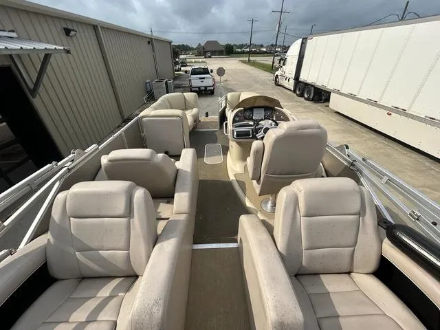 Slide: The Image of 2015 Godfrey SANPAN 2200 SLR pontoon boat with beige seating and steering console. - 7