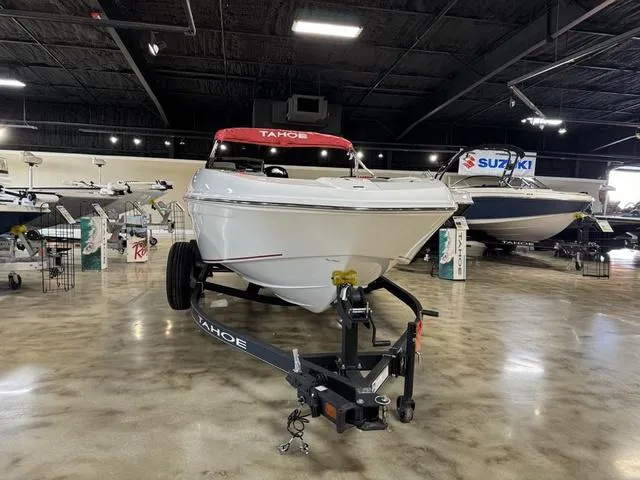 Slide: The Image of 2024 Tahoe T18 boat displayed in showroom with polished concrete floor. - 5