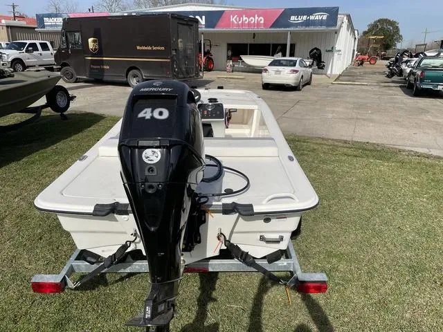Slide: The Image of 2023 Mako 13CC boat with Mercury 40 outboard motor on trailer. - 4