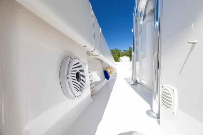 Slide: The Image of 2021 Contender 39FA Fish Around boat interior with speaker and seating. - 16