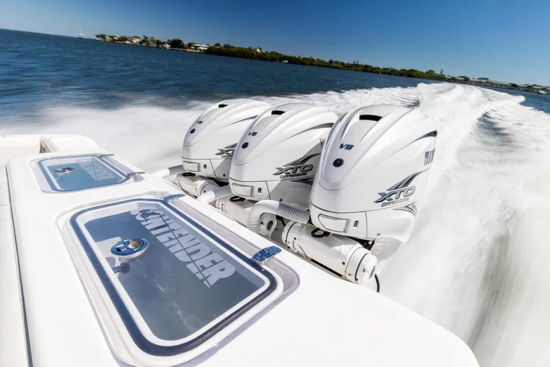 Slide: The Image of 2021 Contender 39FA Fish Around with triple Yamaha outboard engines on the water. - 26