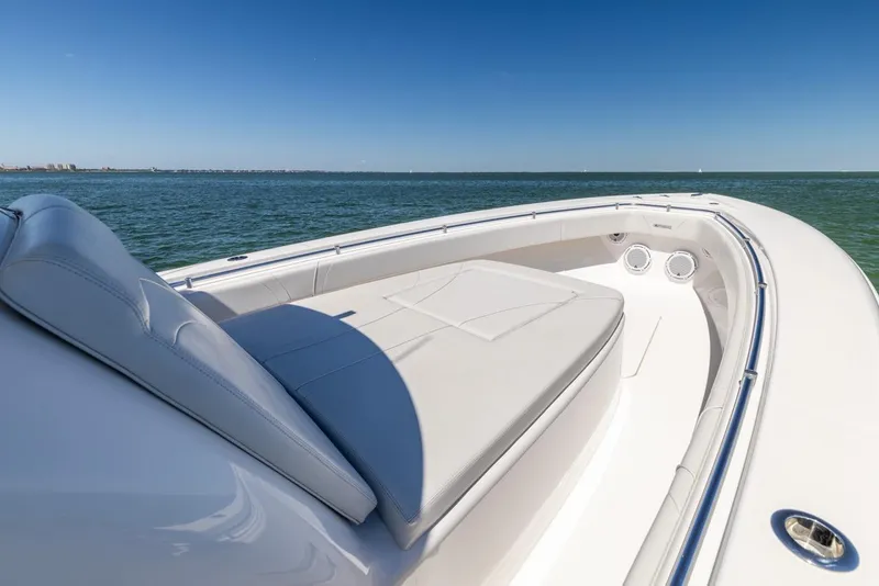 Slide: The Image of 2021 Contender 39FA Fish Around boat with cushioned seating on open water. - 28