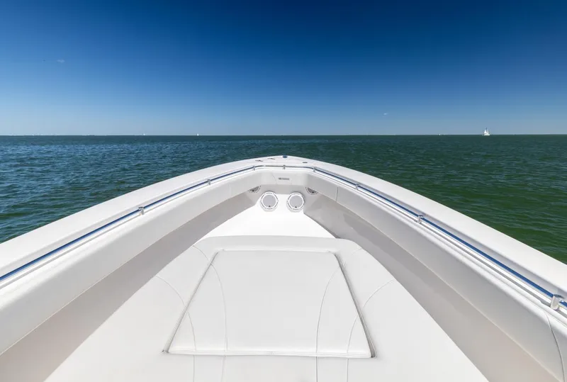 Slide: The Image of Bow view of 2021 Contender 39FA Fish Around boat on open water. - 30